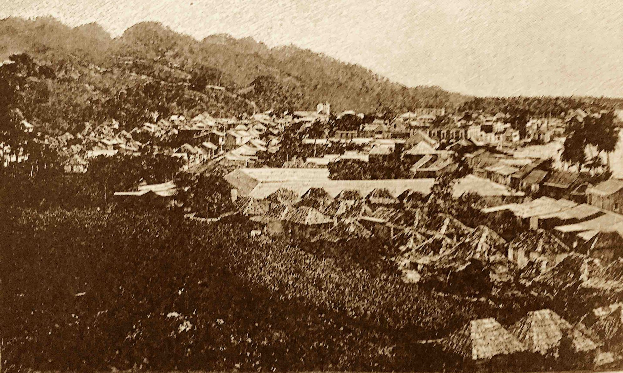 foto shows landscape with houses and bay of Aguadilla in 1898