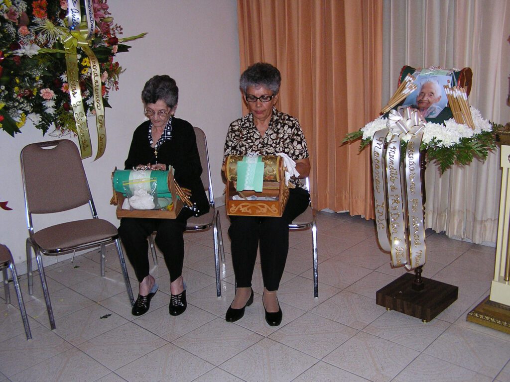 Nelly Vera and Yolanda Romero Aviles lacemaking in honor of Virginia Rodriguez Arocho, 2007.